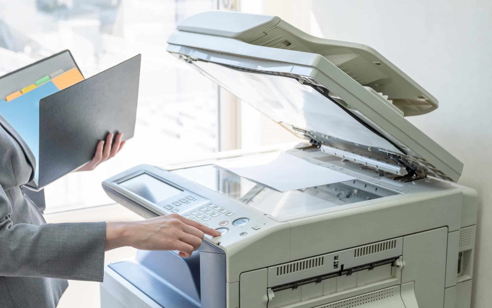 Businesswoman using a copier